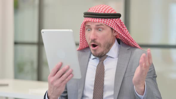 Portrait of Middle Aged Arab Businessman having Loss on Tablet in Office