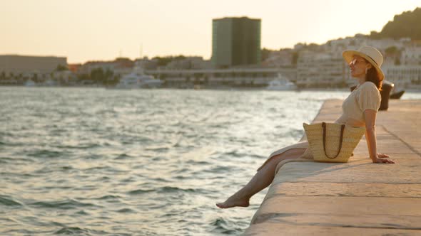 Attractive girl on the pier. Split, Croatia, video 6k