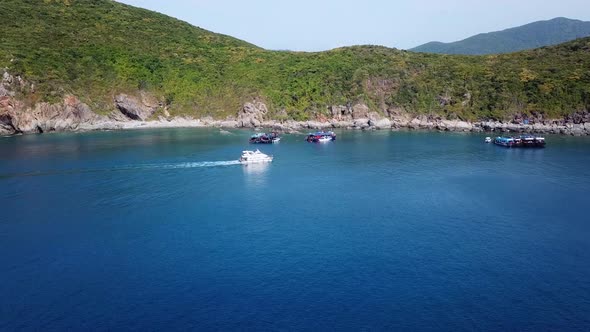 Drone View of Several Speedboats near Island in Snorkelling Spot.