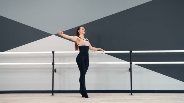 Female Dancer Training in Ballet Studio