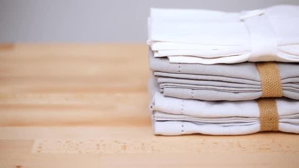 New linen dinner napkin on wood table.