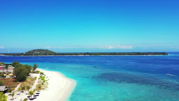 Aerial view panorama of marine seashore beach vacation by aqua blue lagoon and white sandy backgroun