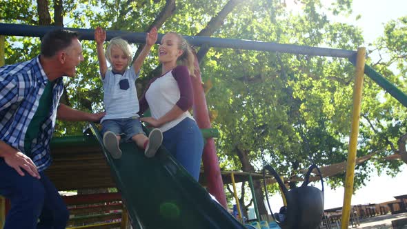 Family playing in the playground 4k