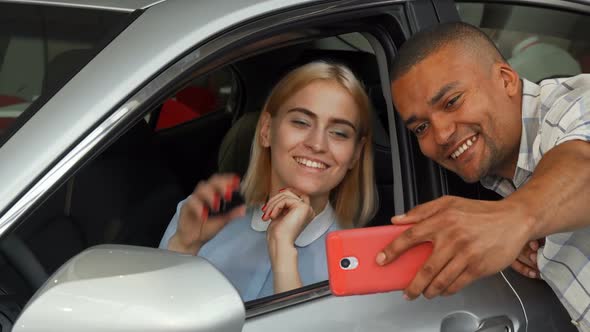 Happy Loving Couple Taking Selfies with Their New Car 1080p