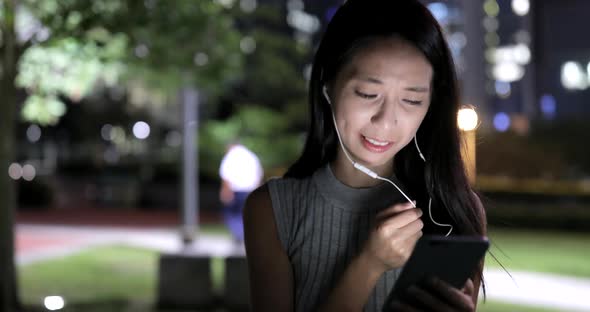 Woman use of mobile phone at night 