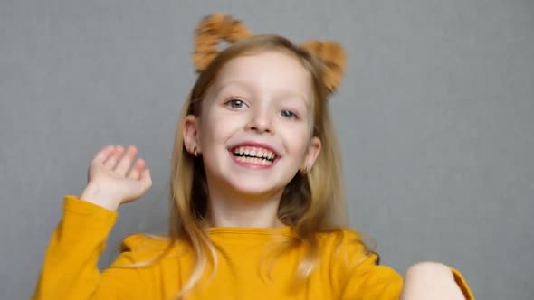 Cute Smiling Blond Girl with Tiger Ears