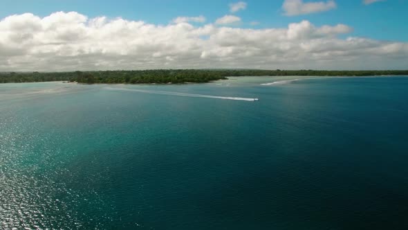 Two Speedboats Sailing Offcoast From Exotic Island In Turquoise Water of Tropical Sea, Cinematic Aer