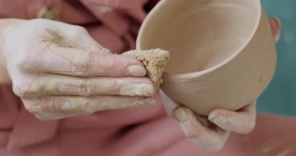 Female Potter Sitting and Makes a Cup. Woman Making Ceramic Item. Pottery Working, Handmade and