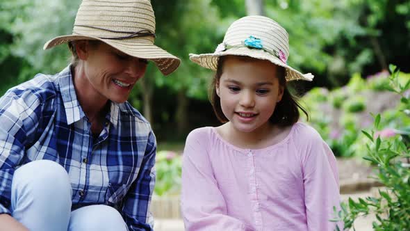 Mother and daughter gardening