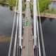A Man Walks on a Rope Stretched Between the Supports of the Bridge at High Altitude. - VideoHive Item for Sale