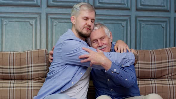 Adult Man Son Hugging and Consoling Sadness Old Age Father with Love Mental Health Social Problems