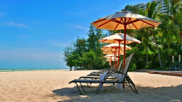 Umbrella and chair on the beach and sea landscape for travel
