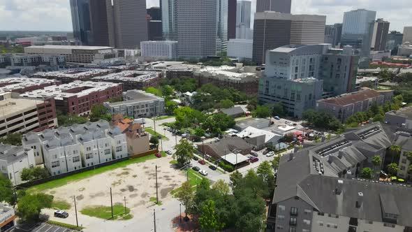 Aerial of Houston downtown skyline at noon, tilt up reveal.