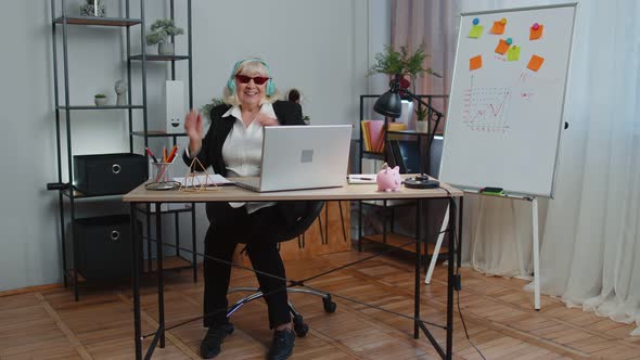 Happy Senior Business Woman Dancing Victory Dance Celebrating Weekend Holiday Success Win in Office