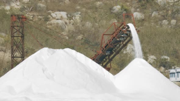 Conveyor Belt Starts To Pour Salt To Heap By Hills