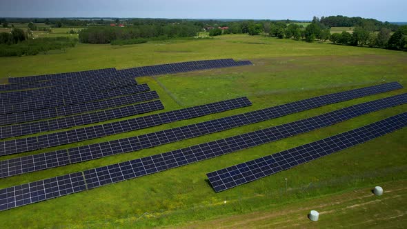 Solar Panel Rows in Field for Renewable Energy Generation, Aerial View