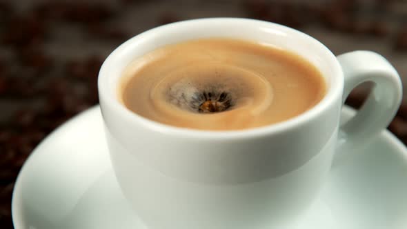 Drop Falling Into a Cup of Coffee in Super Slowmotion