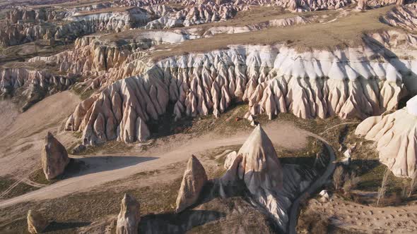 Aerial footage Cappadocia landscape and rose valley at sunset. Turkey