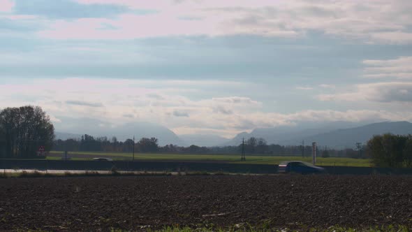 solar farm with highway traffic in background