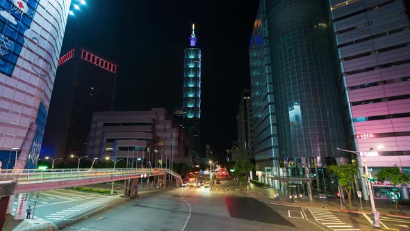 time lapse of Taipei 101 tower with traffic on road at night in Taipei, Taiwan