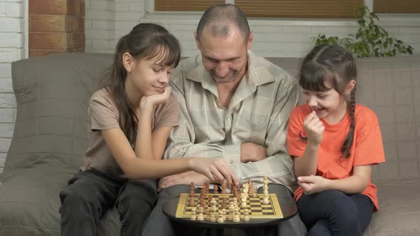 Dad with Children with Mental Chess