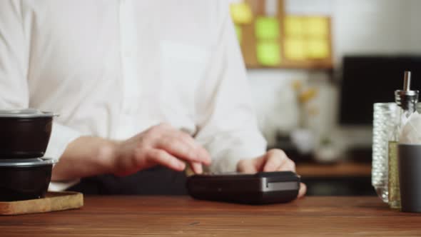 Paying with Credit Bank Card in Cafe