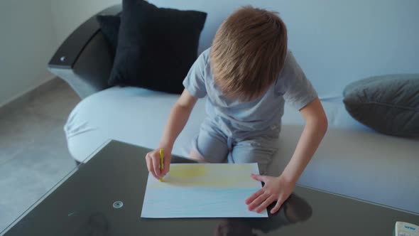 Little Boy Draws the Ukrainian Flag