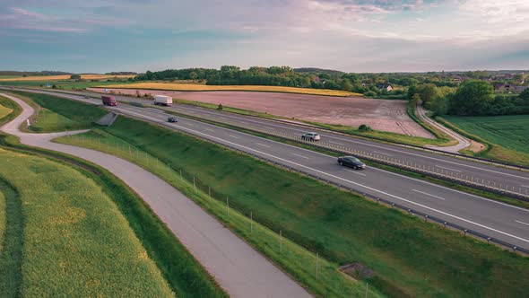 Aerial Hyper Lapse Shot of Highway or Motorway between Fields in a Countryside