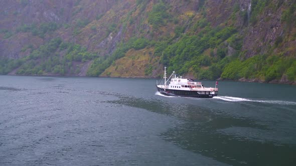 Cruise Ship Sailing Along the Fiord