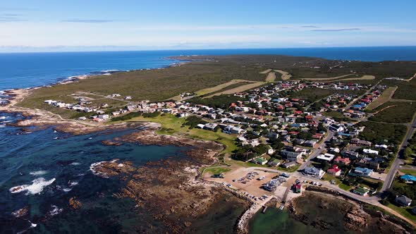 Kleinbaai and its harbour, heart of shark cage diving industry; aerial pan