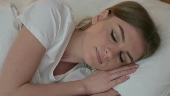 Portrait of Beautiful Young Woman Thinking in Bed 