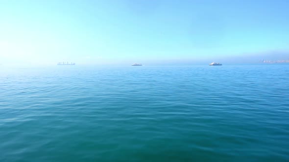 An Ocean Liner Enters The Lighthouse Harbor