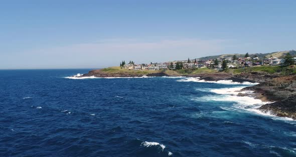 Drone aerial footage of waves crashing against the coastline on the south coast of Australia