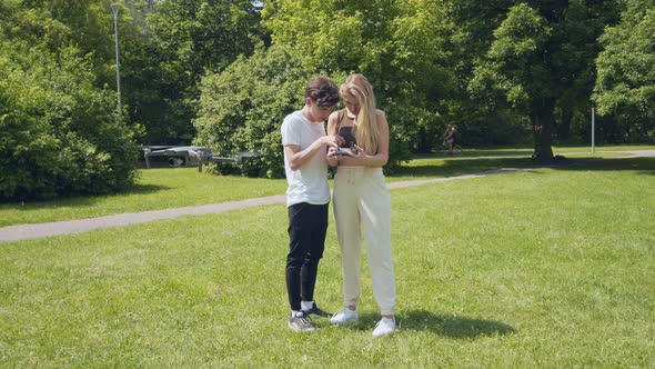 Couple Learning To Fly Drone