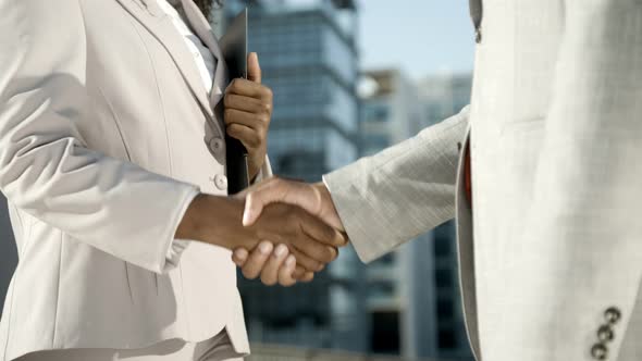 Confident Workers Meeting on Street During Sunny Day