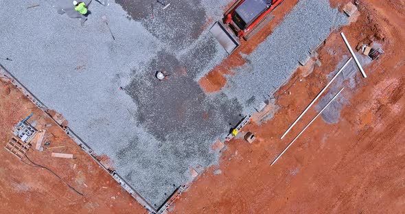 Excavator Working in Excavator Bucket Leveling Gravel the Building Foundation on a Construction Site