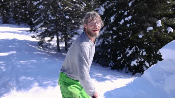 Playing with a Shovel and Fresh Snow in Wintertime