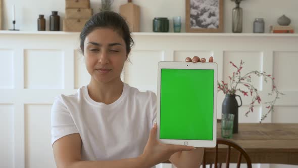 Young Happy Beautiful Indian Businesswoman Thinking While Showing Digital Tablet