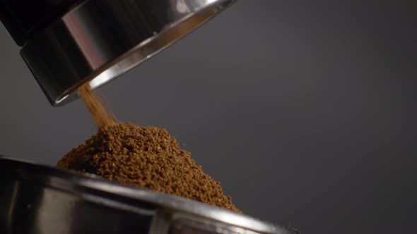 Grinder Making Coffee Powder Grinding Aromatic Beans in Filter Holder Close Up