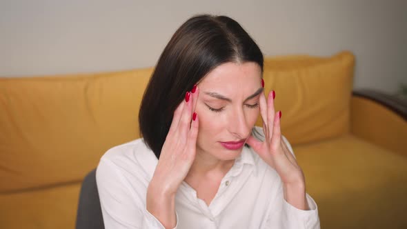 Portrait of Exhausted Frustrated Woman Massaging Nose Bridge Temples