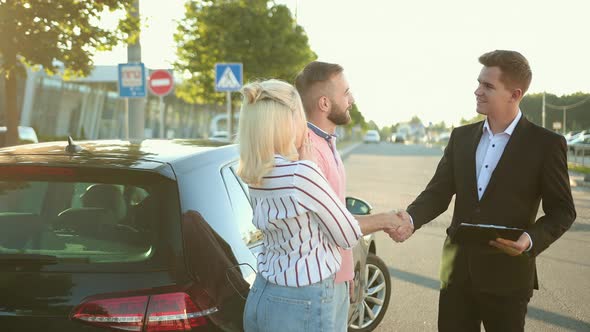 Seller Sells the Car to Happy Young Couple