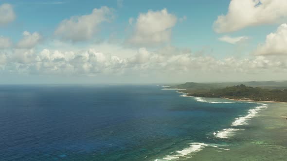 The Coast of Siargao Island, Blue Ocean and Waves