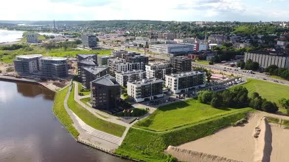 Aerial View, Modern Riverfront Sustainable Housing Complex in Kaunas, Lithuania on Summer Day, Drone