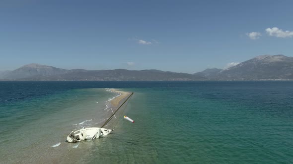 Aerial view of boat aground at sandbank in Gulf of Patras, Greece.