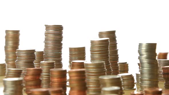 Camera Moves Past Stacks Of Coins