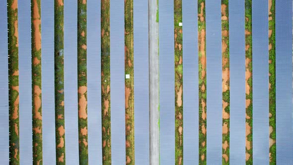 Drone fly over solar farm, renewable energy from solar.