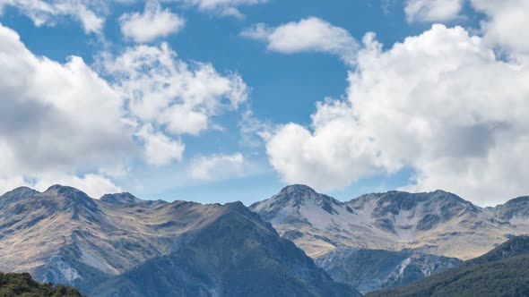 Blue Sky and White Clouds over Alps Mountains