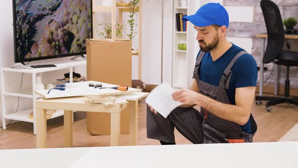 Professional Furniture Assembly Worker Checking Position of the Shelf