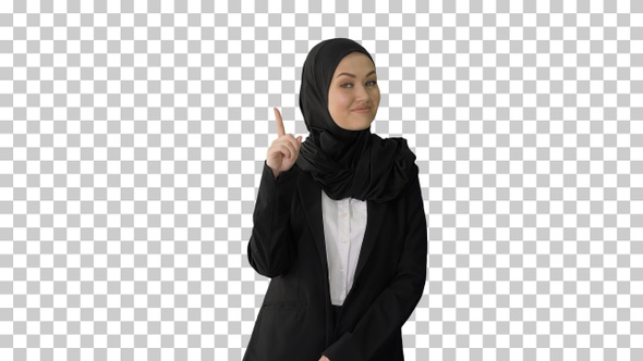 Arab businesswoman in hijab raising finger, Alpha Channel