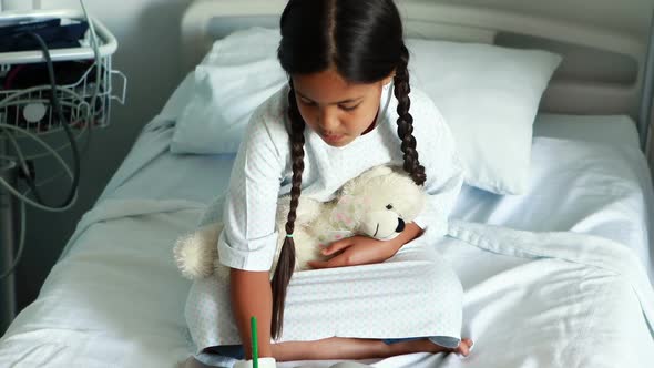 Girl drawing picture in a book